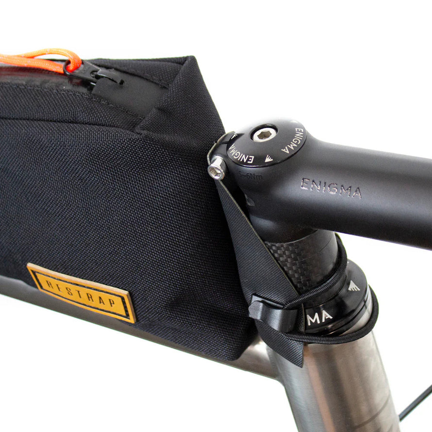 Fixation sur jeu de direction avec cordon élastique – sacoche Top Tube Restrap.
