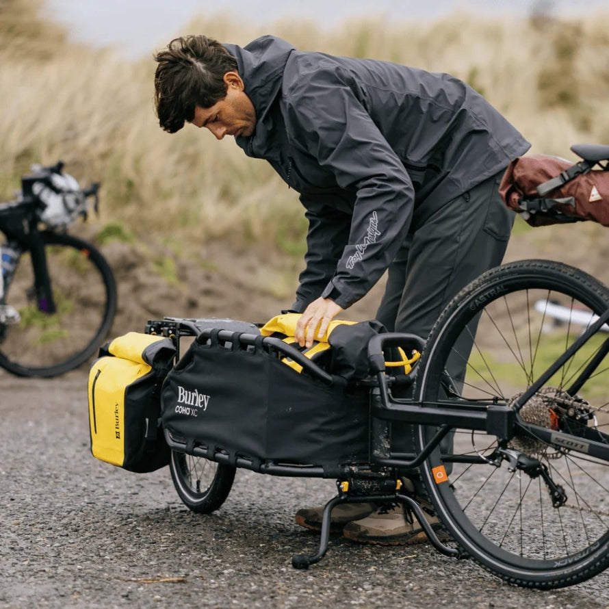 Adaptateur de fixation axe à écrous Burley pour remorque Coho XC, garantissant un transport vélo sûr et stable
