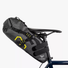 Sacoche de selle bikepacking Apidura Expedition pour vélo gravel et voyage à vélo, vue de profil 14L