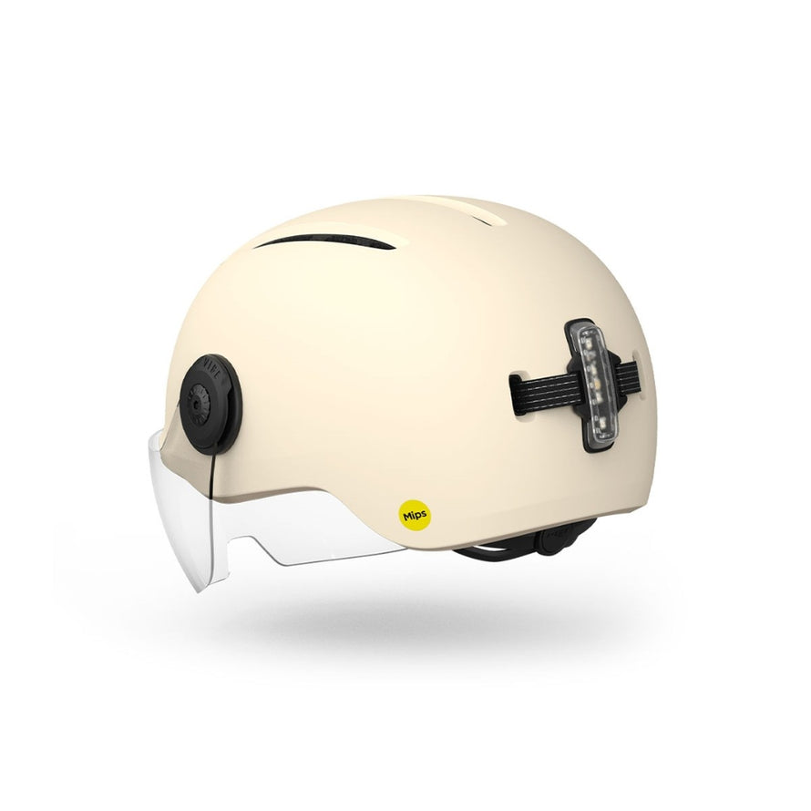 Casque Met Vibe On Mips ecru avec visiere et feu arriere LED pour securite en velo