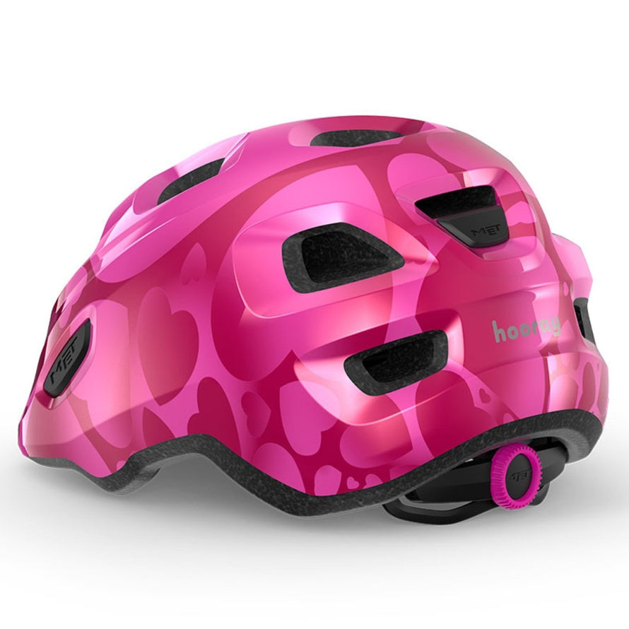 Casque velo enfant Hourra MET rose avec motifs coeurs, compatible siege velo enfant pour securite et confort