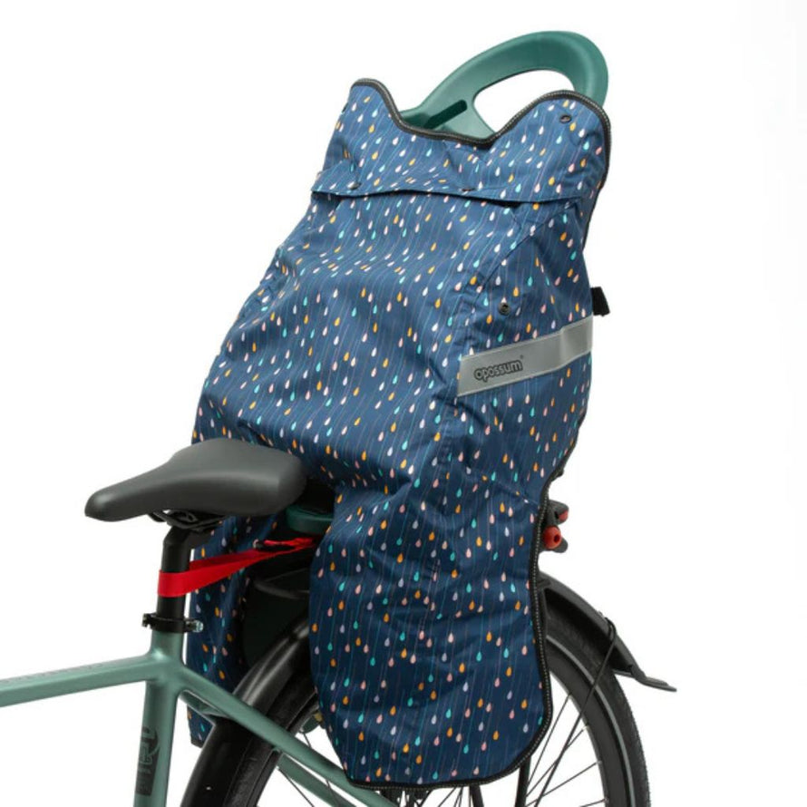 Housse de protection Opossum Magic Splash couvrant le siège arrière vélo enfant, design pluie multicolore