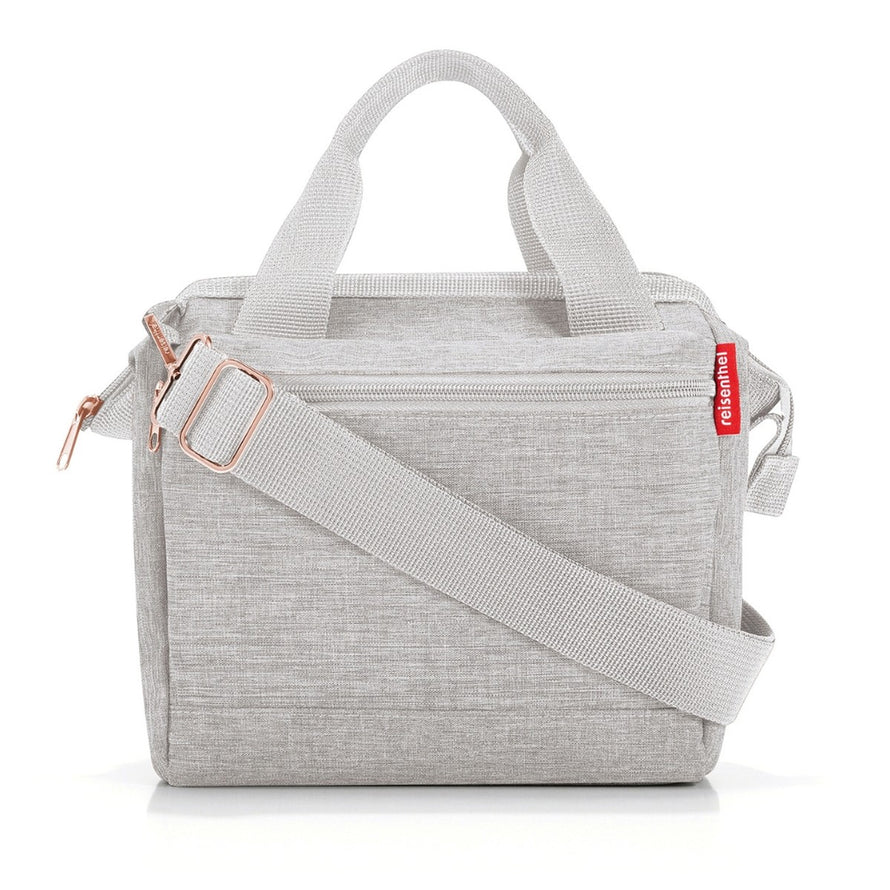 Sacoche guidon vélo Klickfix Roomy 4L gris clair avec bandoulière rose, élégante et fonctionnelle pour cyclistes urbains
