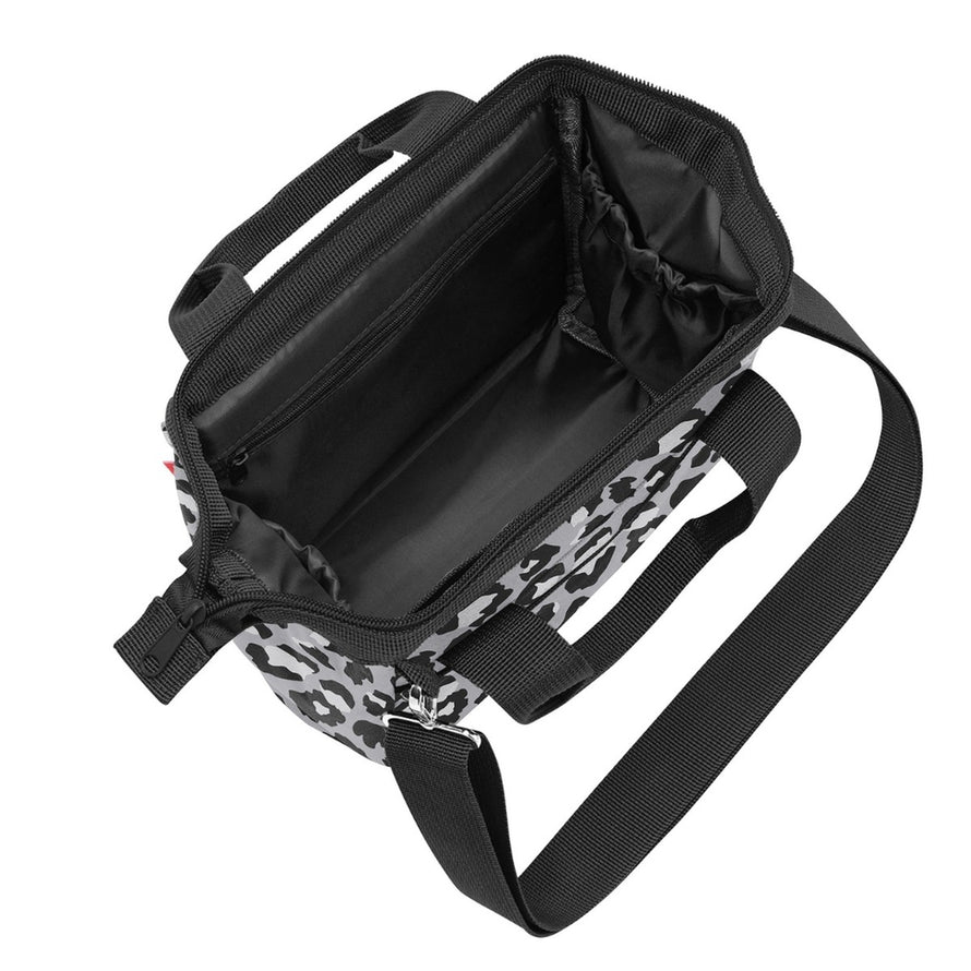 Sacoche guidon vélo Klickfix Roomy 4L avec bandoulière, motif noir et blanc, compartiments pratiques