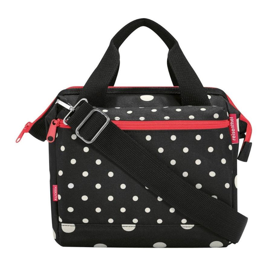 Sacoche guidon vélo Klickfix Roomy 4L noire à pois blancs avec bandoulière, pratique et élégante pour cyclistes urbains