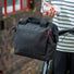 Sacoche guidon Klickfix Roomy 4L noire avec bandoulière, idéale pour transporter vos affaires à vélo