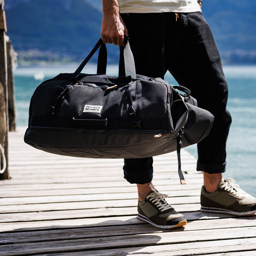 Sac de voyage Duflebag SMÖGEN 80L Meromero, sac noir robuste à porter à la main pour déplacements et aventures