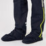 Bas de pantalon Urban Circus Iyuc avec fermeture éclaire latérale et surchaussures intégrées pour protéger les pieds sous la pluie.