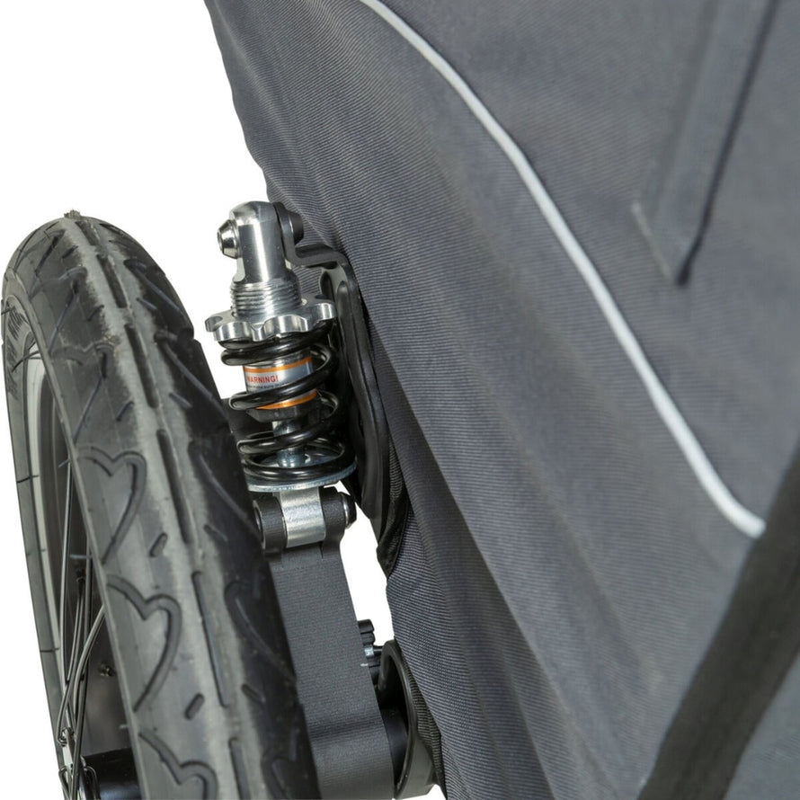 Remorque vélo chien Trixie pliable avec amortisseur ressort, supporte jusqu'à 22 kg pour un confort optimal