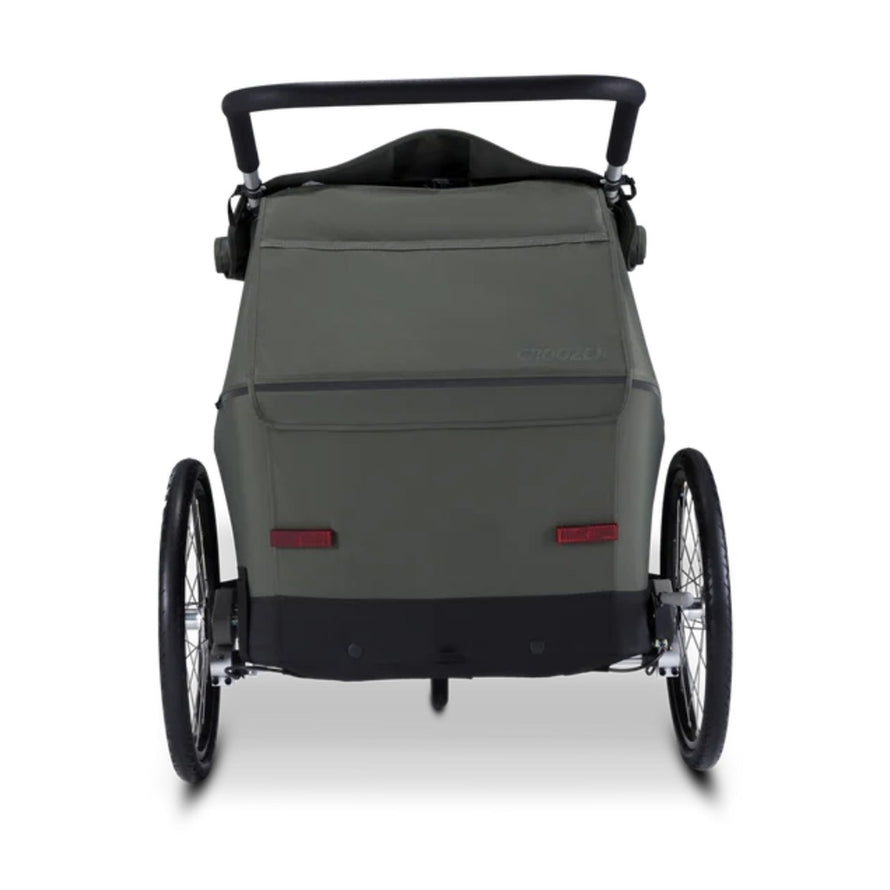 Vue arrière de la remorque vélo enfant 2 places Croozer Kid Ellma 2 olive avec poignées ergonomiques et roues robustes