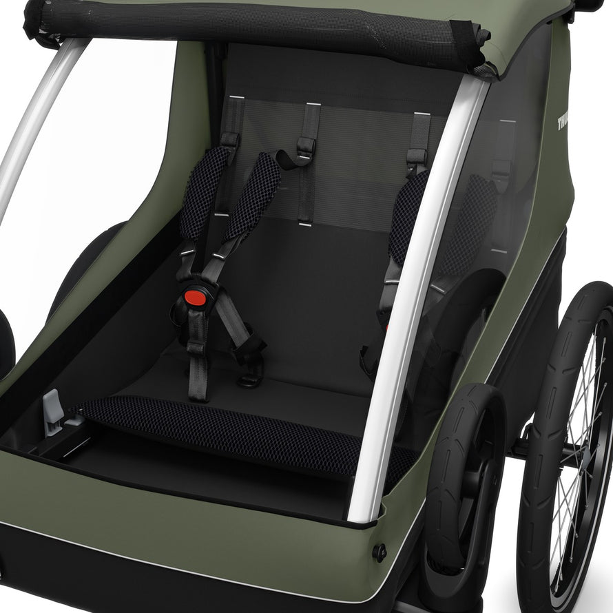 Siège sécurisé de la remorque enfant Thule Courier 2 places en olive avec harnais pour balades à vélo