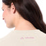 T-shirt Femme Vaude Redmont Heavyweight beige avec logo rose au dos, idéal pour le cyclisme confortable